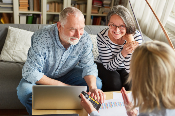 Older couple reviewing paperwork at home
